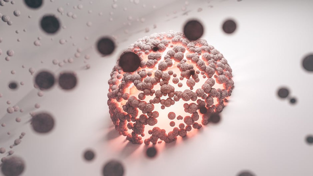 Microscopic view of healthy cells and abnormal (cancerous) cells, illustrating cellular growth differences.